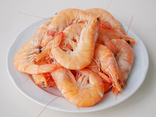 Boiled Langoustines on White Plate close up