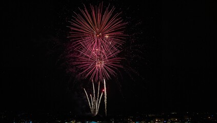 Explosions of color brighten the dark sky