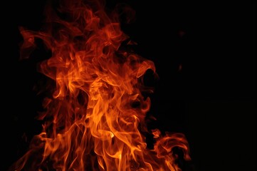 Isolated fire flames against a dark backdrop