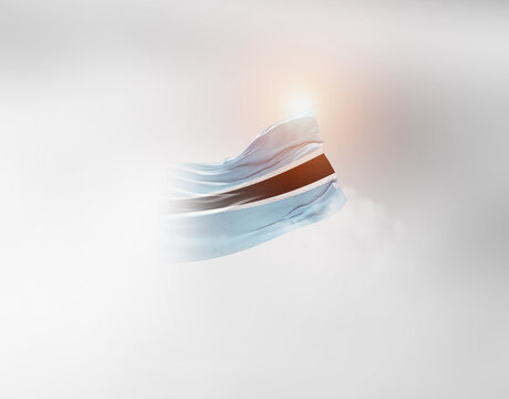 Botswana flag waving light background hidden in the sky. - Powered by Adobe