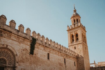 Fototapeta premium Outer facade and minaret of a historic Islamic place of worship