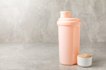 Protein powder. protein shake. Shaker bottle with protein. Food supplement. Whey protein powder with shaker for mixing. Sports nutrition. Concept of sports and healthy lifestyle. Sports equipment