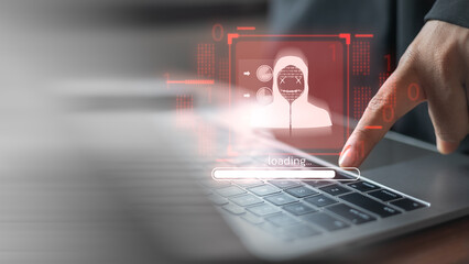 Cybersecurity hacking and data breach concept with a hacker loading malware on laptop. Idea of cyber attack, phishing, ransomware, identity theft, IT risk management, and digital security protection.