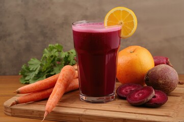 Vegetable assortment with a glass of vibrant beetroot juice