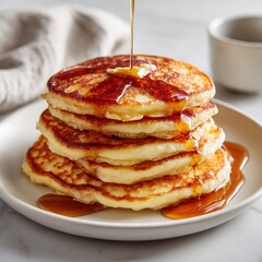 Stack of Pancakes with Syrup and Butter