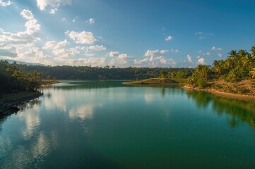 Artificial lake formed by spring water with an adjacent natural swimming area, estimated depth between 9 to 12 meters (30 to 39 feet).
