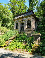 wonderful view of a dilapidated old mausoleum in a cemetery