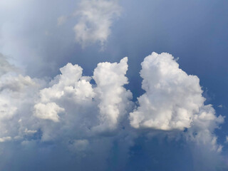 Bright Cumulus Clouds in Clear Blue Sky