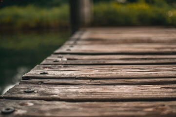 Obraz premium Detailed look at a weathered timber pier, focused area with room for text