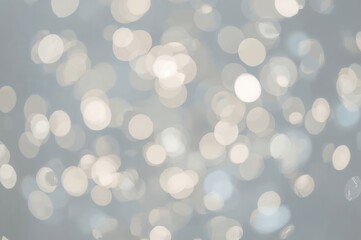Softly focused silver bokeh lights creating a dreamy and glowing circular pattern