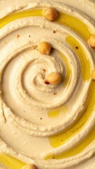 Creamy Hummus Swirl with Olive Oil and Chickpeas on Rustic Background