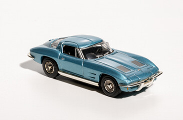 Model of vintage american sports car on white background