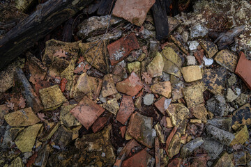 Broken tile on the ground in the forest Corfu, Greece. Abstract background.