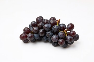 Fototapeta premium Black grapes on a plain white backdrop