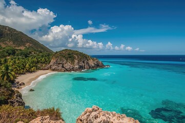 Obraz premium Rocky Mountain Shoreline on a Deserted Island with Water and Blue Sky