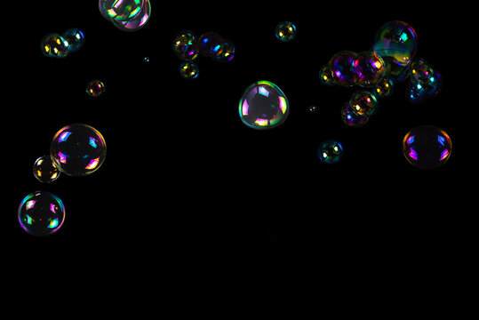 Soap bubbles isolated on a black background.