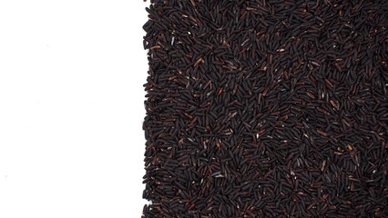 Vertical border of riceberry rice grains on the right side over white background. Perfect for food advertising, organic product design