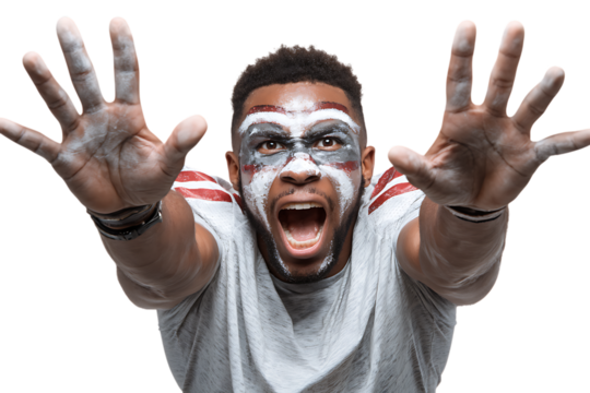 Excited man with face paint celebrating victory.