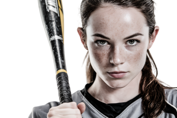 Close up portrait of a determined female softball player.