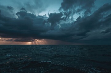 Ominous stormy clouds looming above the ocean