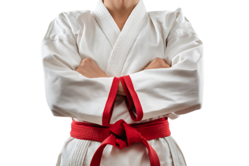 Karate fighter with red belt, arms crossed.