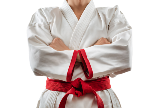 Karate fighter with red belt, arms crossed.