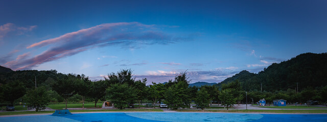 Panoramic view of the campsite after sunset