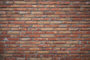 Obraz premium Red and brown brick wall texture with grey accents, ideal for modern backgrounds.