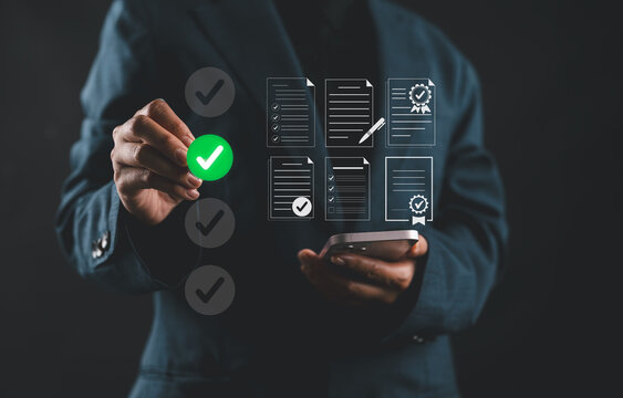 Businesswoman validating digital documents with green check mark symbol. Concept of certification, approval process and digital verification in business or compliance operations.