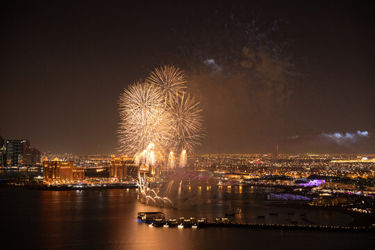 Aerial view of Qatar National Day fireworks lighting up the night sky over Doha, celebrating the nation&rsquo;s heritage and unity &ndash; stock footage.