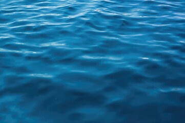 Abstract blue water surface with natural light and textured lines