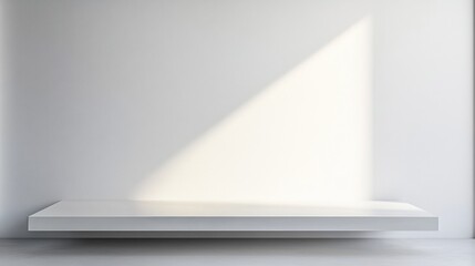 A minimalist display shelf against a plain wall, illuminated by soft light, creating a serene and modern aesthetic.
