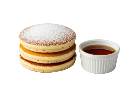 Stack of three golden-brown fluffy pancakes with powdered sugar, alongside a white ramekin of amber maple syrup, isolated on transparent, close-up, bright studio light, concept of culinary perfection