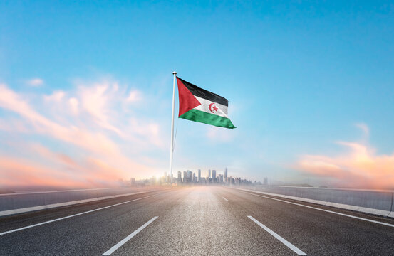 Western Sahara national flag with mast waving with beautiful skyline. A view from highway. Western Sahara national flag for independence day. Free palenstine, no war. Save palenstine.