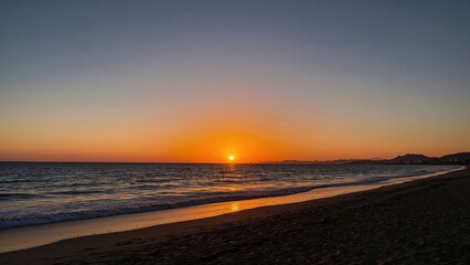 Golden sunset over the western shore beach