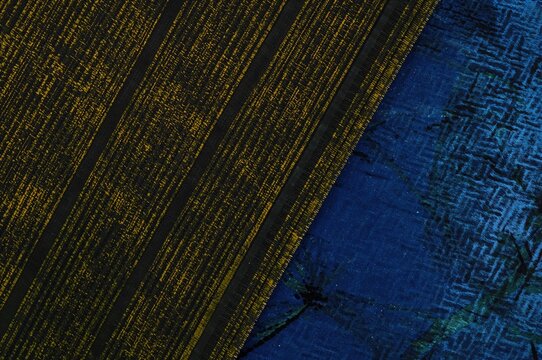 Close-up of Cotton Gamcha Bath Towel with Black and Yellow Stripes Featuring Abstract Patterns and Textures