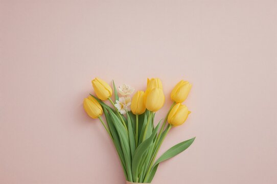 Top-down photo of a vibrant bouquet of yellow tulips against a pink backdrop with empty space for writing - Powered by Adobe