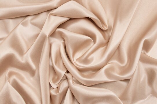 Top view of beige silk material texture used as background - Powered by Adobe