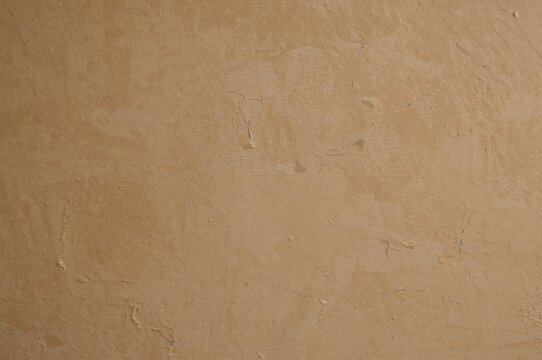 Beige rough surface with abstract stone and cement patterns
