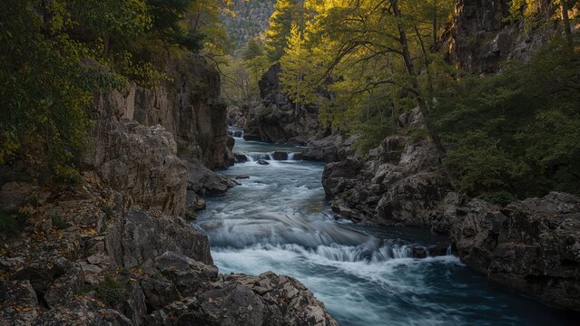 A river meanders through a jagged canyon, resembling a vibrant masterpiece!