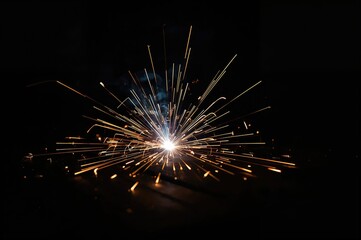 Fototapeta premium Sparks Flying During Metalwork, Radiant Stream of Sparks Against Dark Backdrop, Abstract Energy in Construction and Technology
