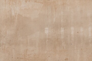 Obraz premium Detailed view of a softly textured beige concrete wall featuring subtle embossing. Simple vintage backdrop in warm shades with ample empty space.