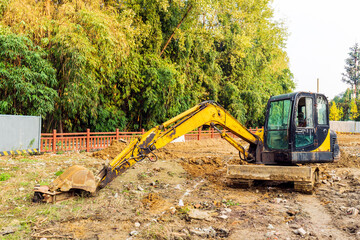 A crawler excavator on the wasteland during the day