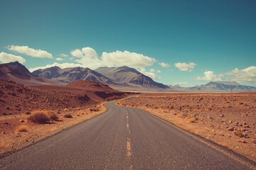 Solitary pathway through a dry, barren landscape