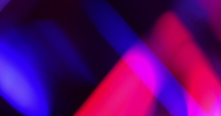Light leak background. Vibrant Prism Light Streaks in Motion. Video capturing dynamic streaks of blue, purple, pink, and red lights - real effect.	 - Powered by Adobe