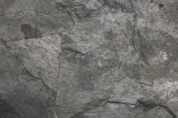 Abstract textured gray rock surface with natural stone pattern and vintage design