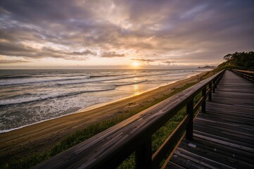 Fototapeta premium Sunset seen from the dock with overcast skies and sea vistas