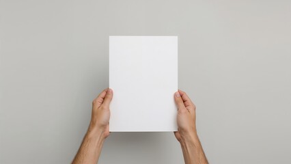 White blank paper held by hands