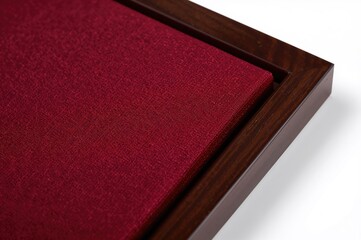 Fototapeta premium Detailed view of a wooden frame wrapped in textured fabric against a white backdrop with clipping path