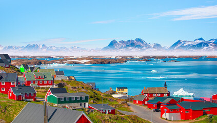 Picturesque village on coast of Greenland - Colorful houses in Tasiilaq, East Greenland